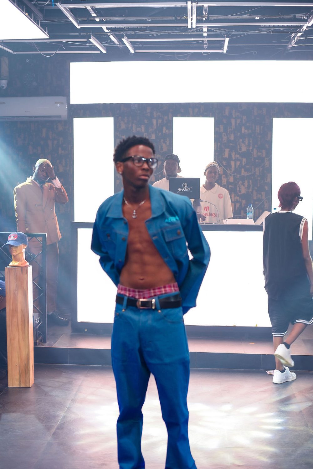 A model in double denim at the head of the runway
